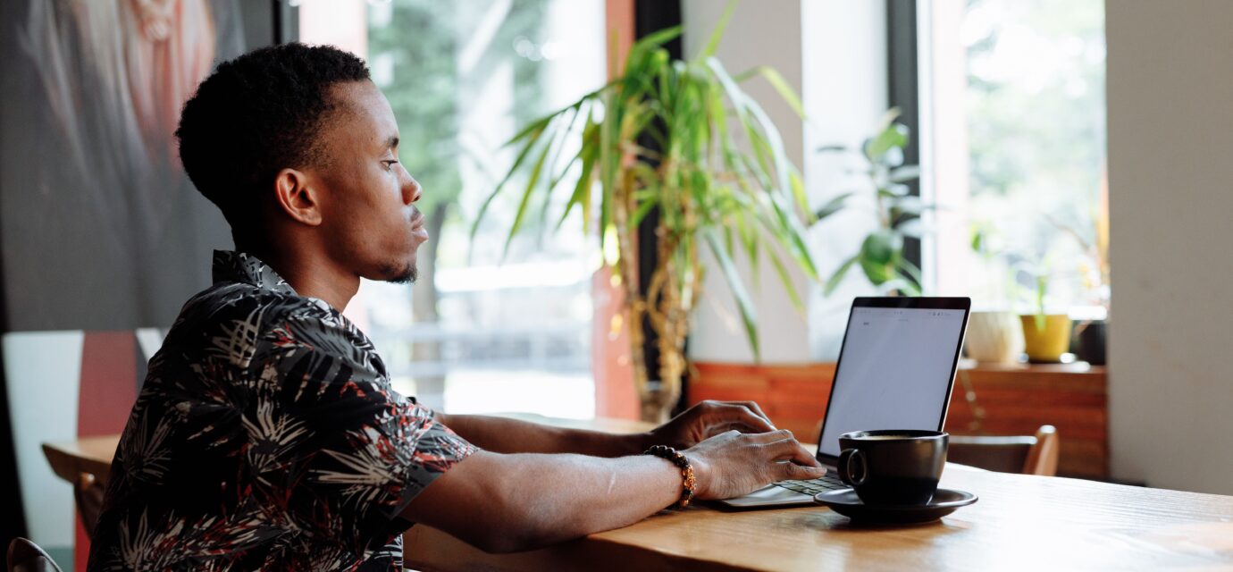 alt: recent graduate building a digital hustle in Kenya's stagnant job market