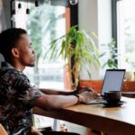 alt: recent graduate building a digital hustle in Kenya's stagnant job market